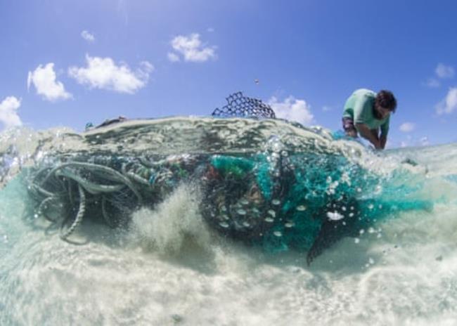 A man collects marine debris